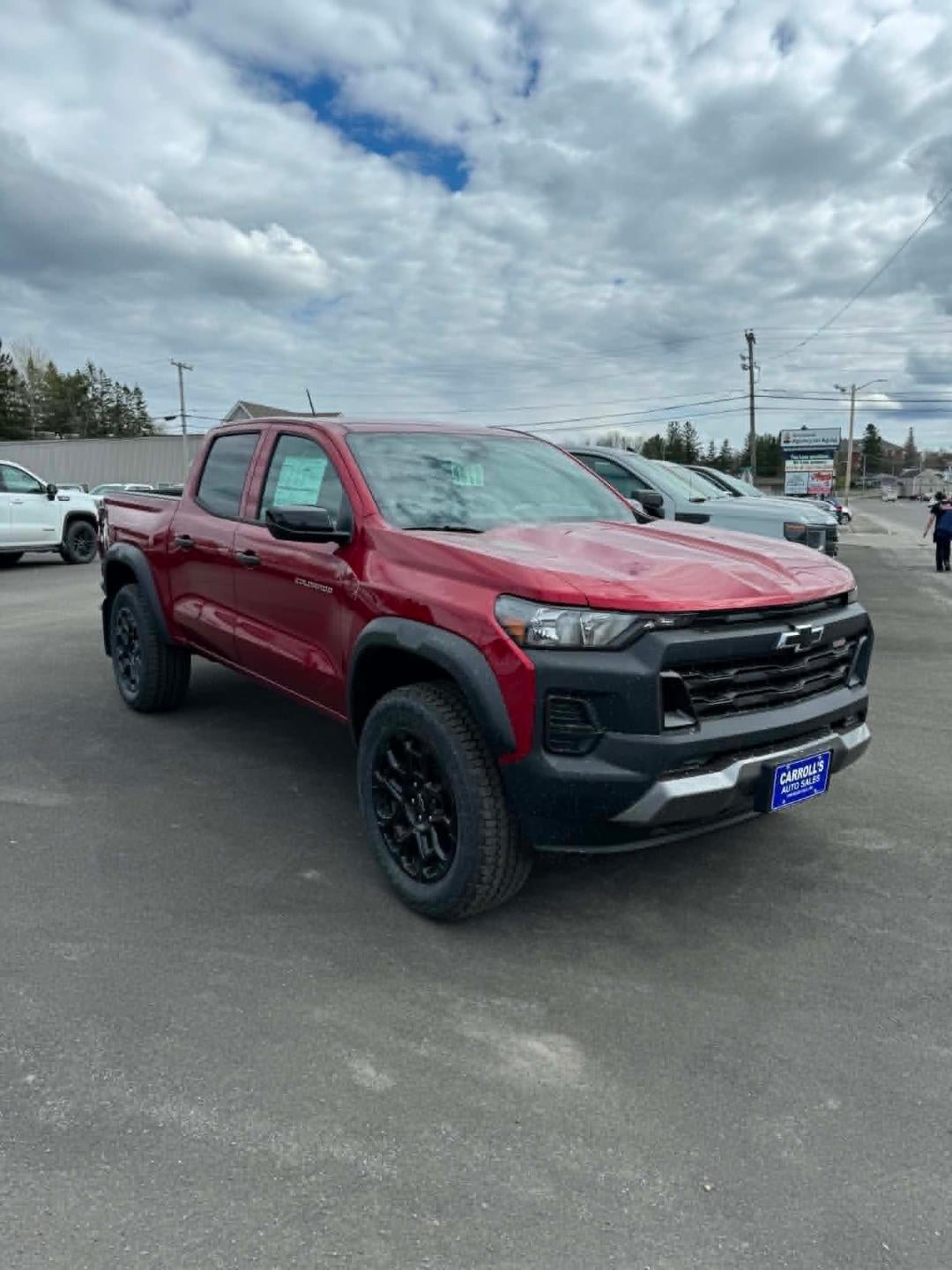 2026 Chevrolet Colorado Trail Boss in Radiant Red Tintcoat — front three-quarter view