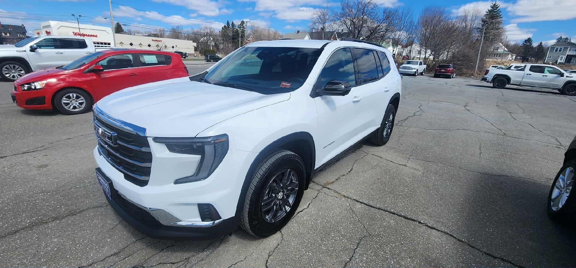 2026 GMC Acadia AWD Elevation in Summit White — front three-quarter view