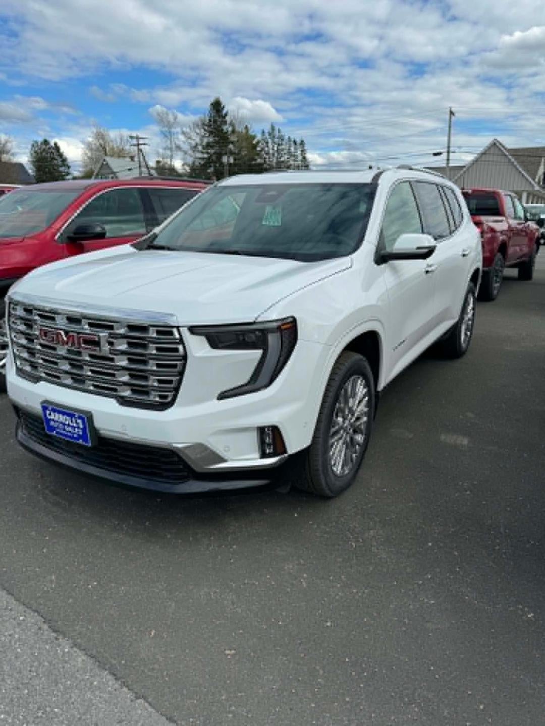 2026 GMC Acadia Denali in Summit White — front three-quarter view