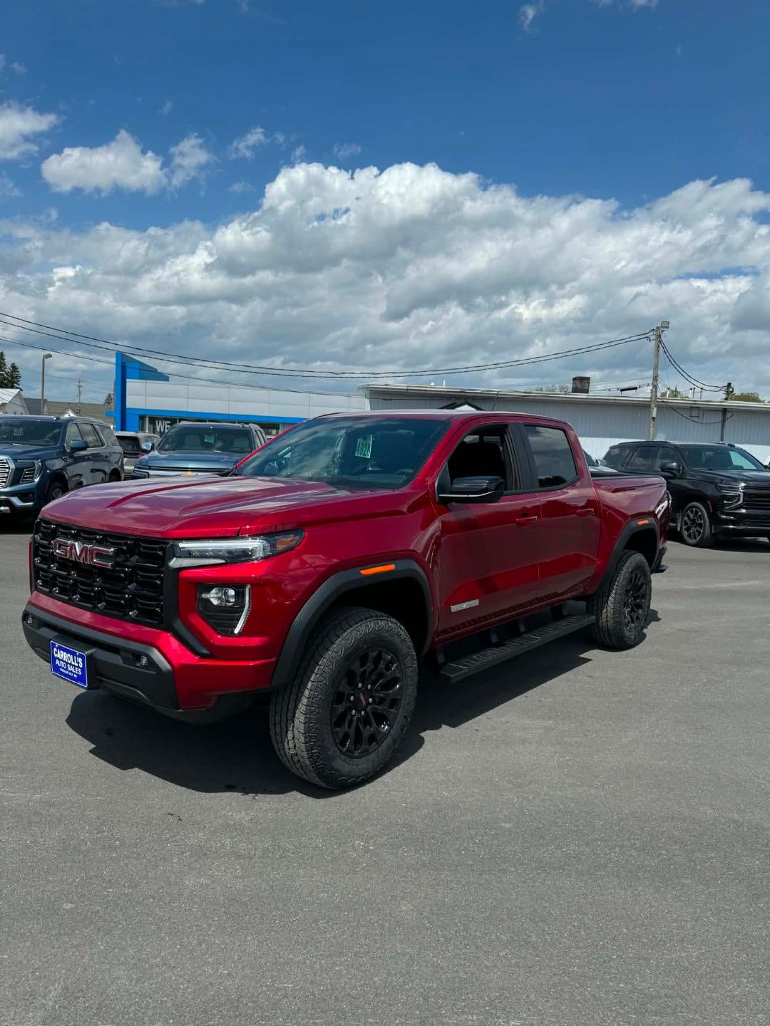2026 GMC Canyon Elevation in Volcanic Red Tintcoat — front three-quarter view